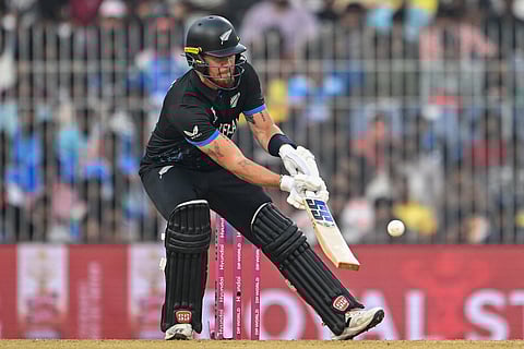 Finn Allen plays a scoop shot