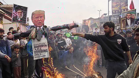 Shiite Muslims burn the effigies of US President Donald Trump and Israeli PM Benjamin Netanyahu during a protest against the killing of Iran's Supreme Leader Ayatollah Ali Khamenei in Budgam, Kashmir, Friday, March 6, 2026.