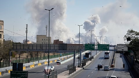 Plumes of smoke rise as strikes hit the city during the U.S.–Israeli military campaign in Tehran, Iran, Thursday, March 5, 2026.