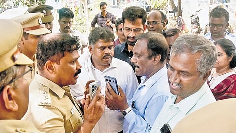 Government doctors argue with the police while attempting to sit on indefinite protest on the Madras Medical College premises on Thursday in Chennai .