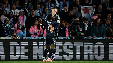 Real Madrid's Federico Valverde celebrates with his teammate Real Madrid's Vinicius Junior after scoring his side's second goal during a Spanish La Liga soccer match between Celta Vigo and Real Madrid in Vigo, Spain, Friday, March 6, 2026. 
