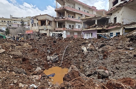 A huge crater left by an Israeli airstrike in the village of Nabi Chit, eastern Lebanon late Friday, March 6, 2026, where Israeli forces landed overnight and dug a grave in a cemetery searching for Israeli co-pilot Ron Arad who was captured and then went missing after his fighter jet crashed over south Lebanon in 1986.