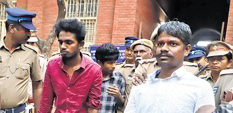 Police take the convicts from the court to prison after the verdict.