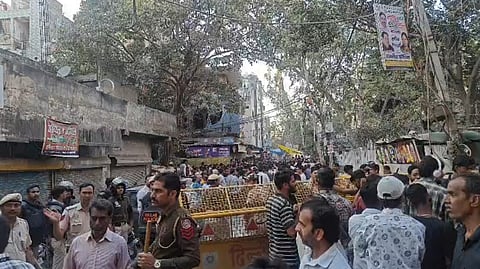 Crowd blocks roads demanding action; police deploy heavy security after 26-year-old beaten to death in dispute triggered by water balloon.