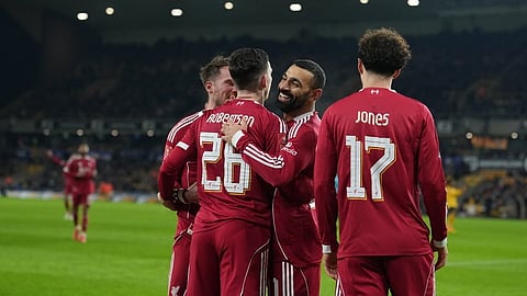 Liverpool's Andrew Robertson celebrates with teammates after scoring during the English FA Cup soccer match between Wolves and Liverpool in Wolverhampton, England, Friday, March 6, 2026.