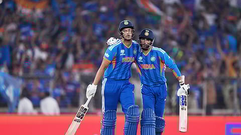 India's Shivam Dube, left, and batting partner Tilak Varma celebrate after a good last over of India's batting inning during the T20 World Cup cricket final match between India and New Zealand in Ahmedabad, India, Sunday, March 8, 2026. 