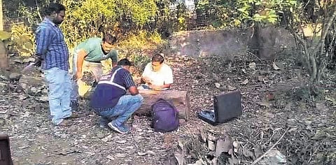 Forensic team collecting evidence from the spot where the body was found