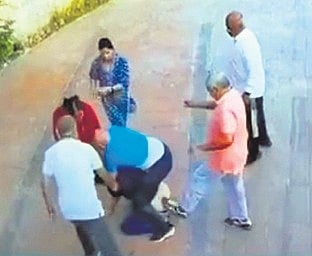 A screengrab of the incident where the elders pushed and kicked a man at an apartment in Varthur. 