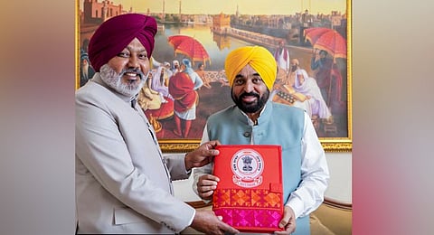 Punjab Chief Minister Bhagwant Mann being presented the 5th Budget of the state government by Punjab Finance Minister Harpal Singh Cheema. 