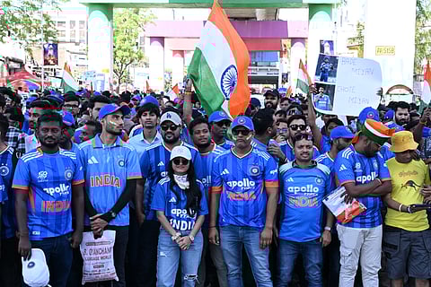 Fans wait outside the Narendra Modi Stadium on Sunday