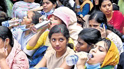 Kerala United Nurses Association members during their protest demanding basic pay hike in front of Kozhikode Collectorate on Tuesday 