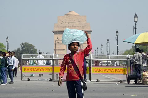 A girl selling mineral water on a hot summer day in New Delhi on Monday. 