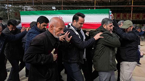The coffin of Mehdi Hosseini, a man killed in a US-Israeli strike, is carried for burial at Behesht-e Zahra cemetery in Tehran, Iran, Monday, March 9, 2026.