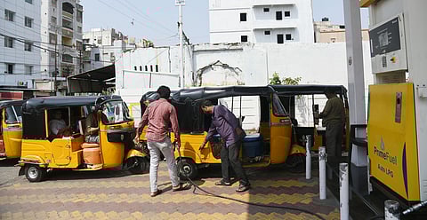 Auto drivers queue up to refill LPG at a gas station amid a shortage, as the fuel price rises by nearly Rs 35 in Hyderabad.
