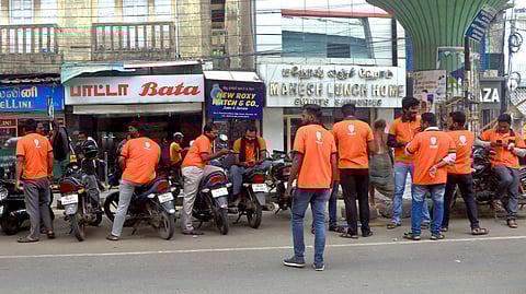 Swiggy delivery executives waiting in Chennai. 