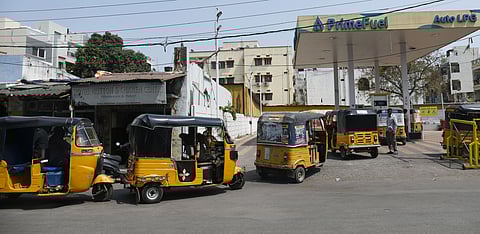 Auto drivers queue up to refill LPG at a gas station amid a shortage, as the fuel price rises by nearly Rs 35 in Hyderabad.