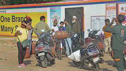 People waiting for LPG Gas Cylinder as crisis still continue in Delhi, in front of a LPG stocks near Rajghat on Wednesday.