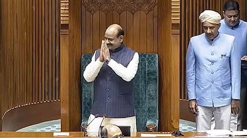 Lok Sabha Speaker Om Birla greets before conducting proceedings in the House during the second part of Budget session of Parliament, in New Delhi, Thursday, March 12, 2026.