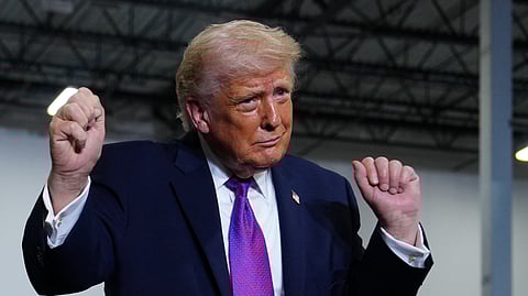 President Donald Trump dances after speaking at Verst Logistics Wednesday, March 11, 2026, in Hebron, Ky.