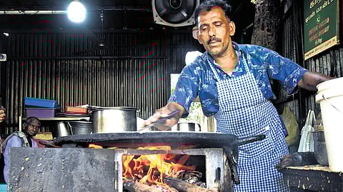 An eatery using a wood stove in Tiruchy on Wednesday.