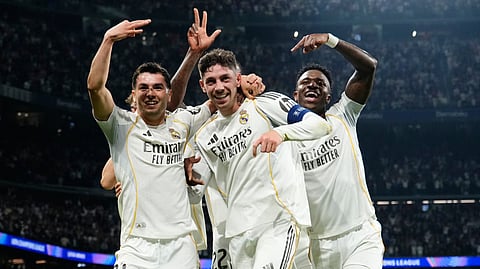 Real Madrid's Federico Valverde, center, celebrates after scoring his third goal during a first leg round of 16 Champions League soccer match between Real Madrid and Manchester City in Madrid, Spain, Wednesday, March 11, 2026.