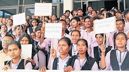 Students staging protest in front of Gajapati collector’s office on Thursday.