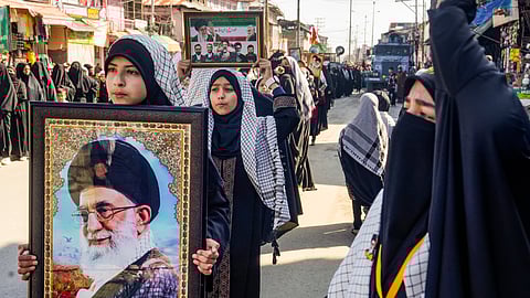 People take part in a Youm-e-Quds protest demonstration expressing solidarity with Palestinians amid the ongoing West Asia conflict, in Magam, Budgam district, Jammu and Kashmir, Friday, March 13, 2026.
