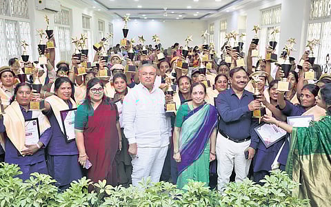 46 women awardees of KSRTC pose for a photograph with Transport Minister Ramalinga Redd, as part of Women’s Day celebration.