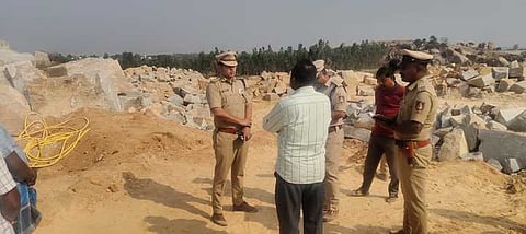 SP Shivanshu Rajput speaks to workers at a quarry at Banagere village in KGF on Friday while DySP Lakshmaiah looks on.