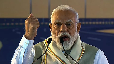 Prime Minister Narendra Modi addresses a gathering during the foundation stone laying and unveiling ceremony of various development works, in Silchar, Assam.