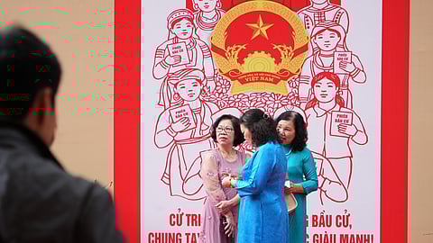 Voters wait to cast ballots to elect representatives in the National Assembly and people's councils in Hanoi, Vietnam, Sunday, March 15, 2026.