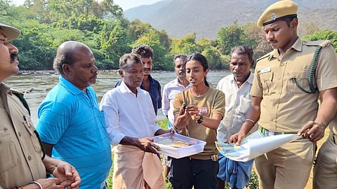 Forest department staff of MTR is creating awareness to tribal people how to conserve hump-backed Masheer at Moyar in MTR.