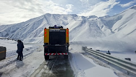 Snow-clearance work underway along the Mughal road, in Srinagar, Monday, March 16, 2026. Most higher reaches of Kashmir received moderate to heavy snowfall, while the plains were lashed by rains, disrupting vehicular movement in some stretches. 