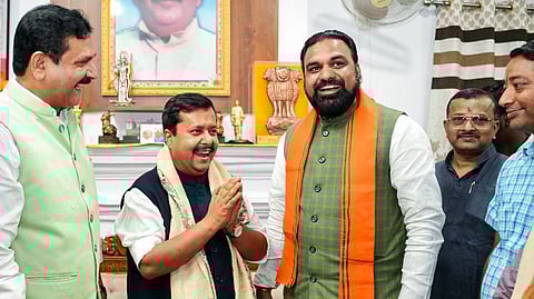 Bihar Deputy Chief Minister Samrat Chaudhary (R) congratulates BJP National President and NDA's Rajya Sabha candidate Nitin Nabin on his victory in Patna on Monday.