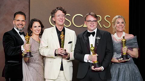 Radovan Sibrt, from left, Alzbeta Karaskova, David Borenstein, Pavel Talankin, and Helle Faber, winners of the award for documentary feature film for "Mr. Nobody Against Putin," pose in the press room at the Oscars on Sunday, March 15, 2026, at the Dolby Theatre in Los Angeles.