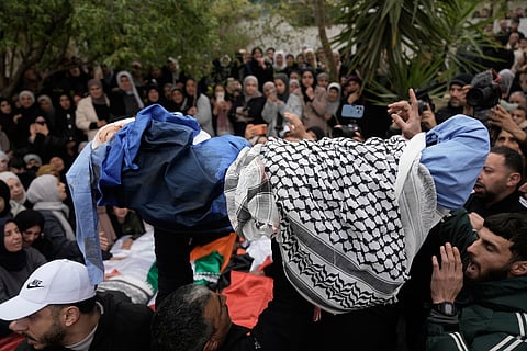 Palestinians carry the body of 5-year-old Muhammad Bani Odeh, at the funeral of four members of the Odeh family who were killed in their car by Israeli security forces in Tammun, West Bank, Sunday, March 15, 2026. 
