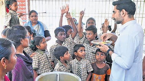 HRD and IT Minister Nara Lokesh interacts with children at Devunicheruvu Mandal Parishad Primary (MPP) School in Mylavaram of NTR district on Tuesday 