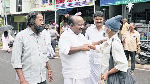 Sitting MLA T J Vinod seeking votes.