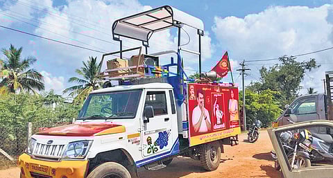 An NTK campaign vehicle fitted with a foldable sunshade and speakers 