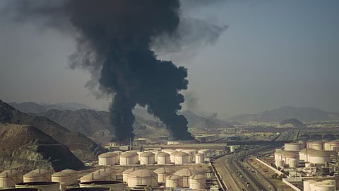 Fire and plumes of smoke rise from an oil facility in Fujairah, United Arab Emirates, Saturday, March 14, 2026. 
