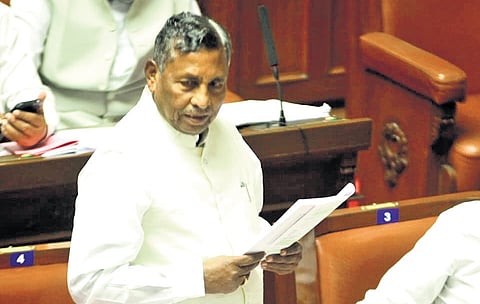 Food and Civil Supplies Minister KH Muniyappa addresses the Legislative Council on Wednesday.