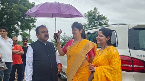 Self-styled godman and astrologer Captain Ashok Kharat with Women’s Commission Chairperson Rupali Chakankar