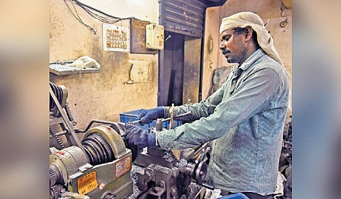 A worker in a small-scale industry in Ambattur Estate.