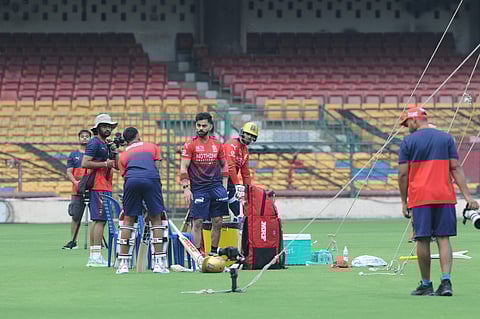 Virat Kohli (C) in practice at the M Chinnaswamy Stadium on Wednesday