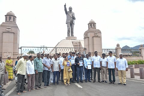 Members of the Christian Coordination Council (CCC) and AIBSP stage a protest at the statue of Dr BR Ambedkar in Vijayawada.