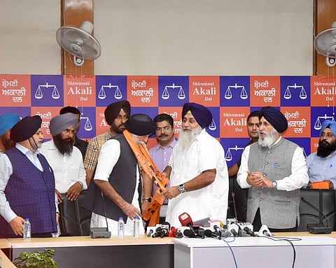 SAD chief Sukhbir Singh Badal inducting former IAS officer Kanwaljeet Singh Cheema into the party on Thursday.