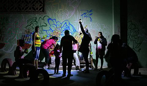 A party held with portable lights during the blackout last week in Havana, Cuba