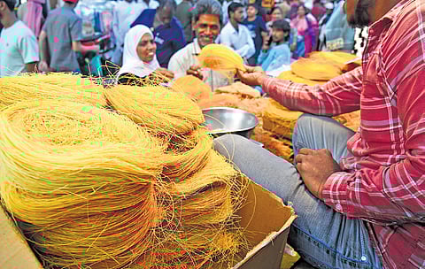 Muslim community members busy shopping in Shivajinagar area ahead of Ramzan festival in Bengaluru on Friday.