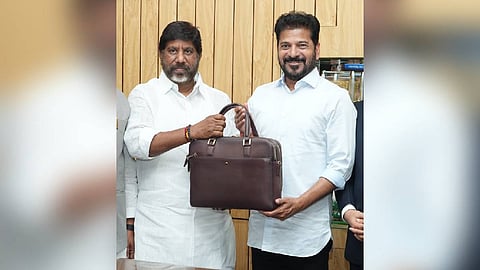 Deputy Chief Minister and Finance Minister Mallu Bhatti Vikramarka (left) presenting Budget estimates to Chief Minister A Revanth Reddy at the lobbies of the Assembly in Hyderabad on Friday.