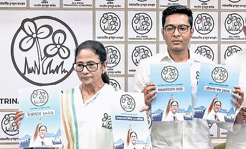 Mamata Banerjee and TMC general secretary Abhishek Banerjee with manifesto | ANI